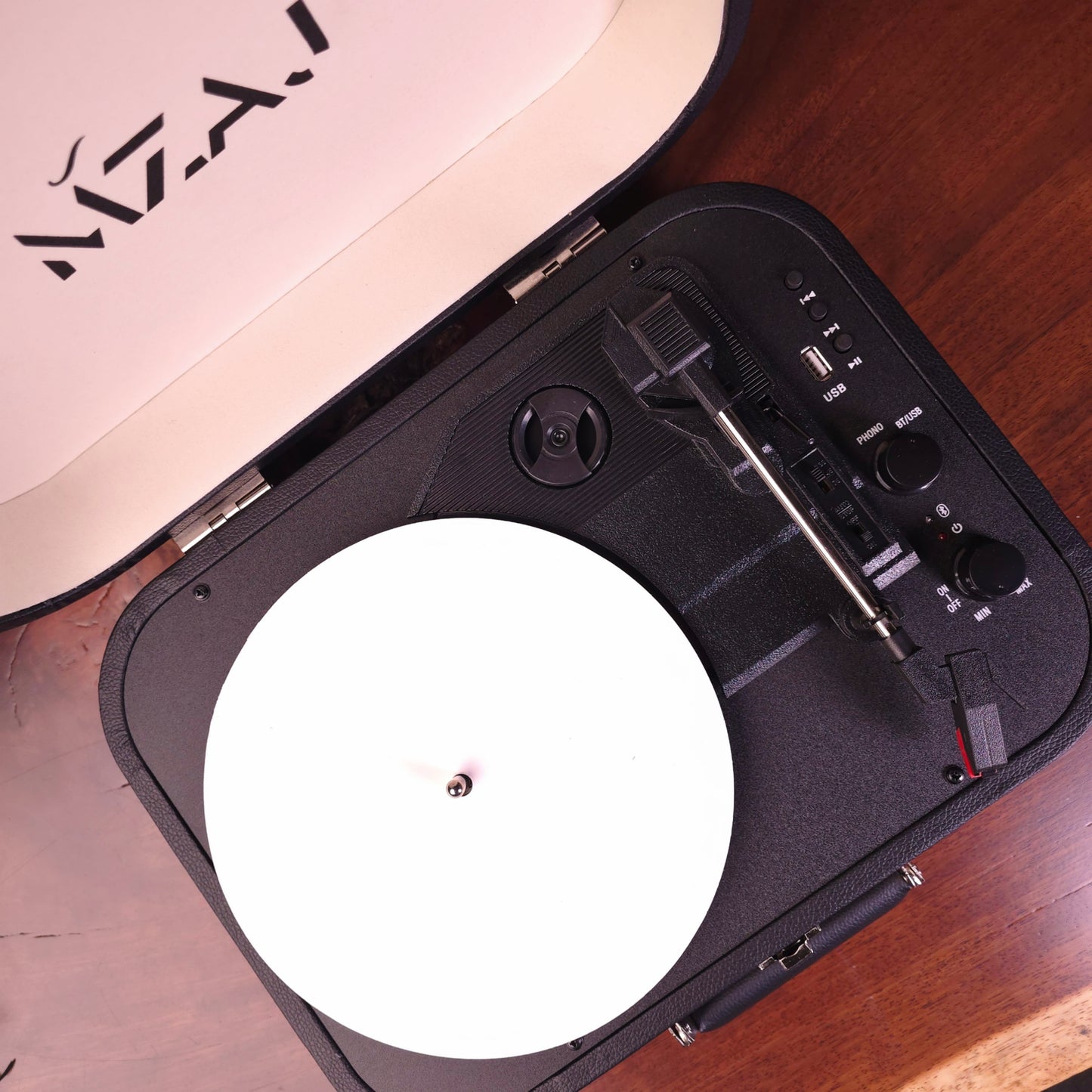 Portable turntable on a wooden surface