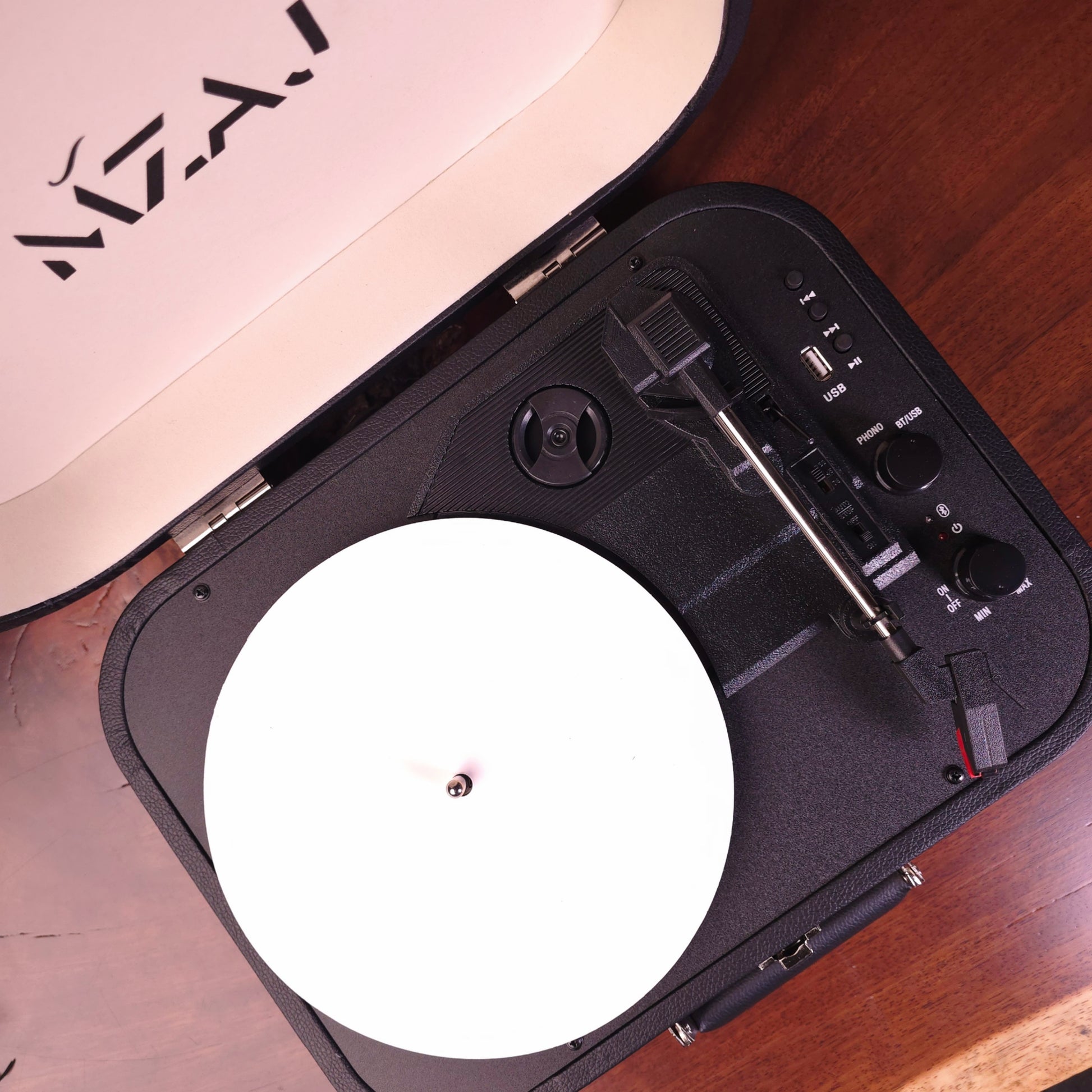 Portable turntable on a wooden surface